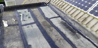 plat dak repareren